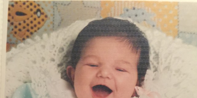 Losing My Daughter to Shwachman-Diamond Syndrome cami smiling as a baby