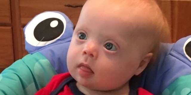 The R-Word Is Offensive, Even When There Is No Ill Intent baby with down syndrome in a walker