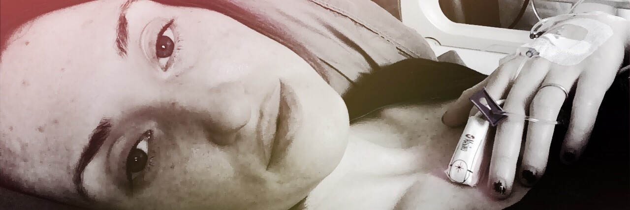 Accepting You Can't Go Back to Life Before Getting Sick photo of woman in hospital bed with red and black lighting