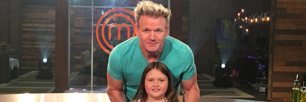 How Gordon Ramsay Helped My Child With Food Allergies Conquer Her 'War With Food' Gordon Ramsay standing behind Abby on the show's set.