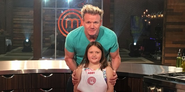 How Gordon Ramsay Helped My Child With Food Allergies Conquer Her 'War With Food' Gordon Ramsay standing behind Abby on the show's set.