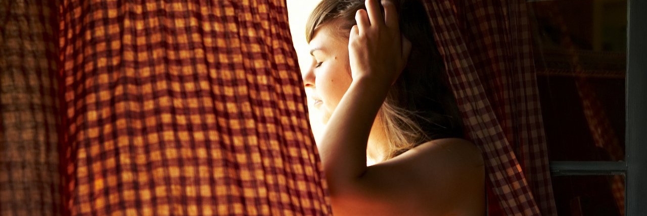 Rediscovering Myself After My Fibromyalgia Diagnosis Woman sitting in window