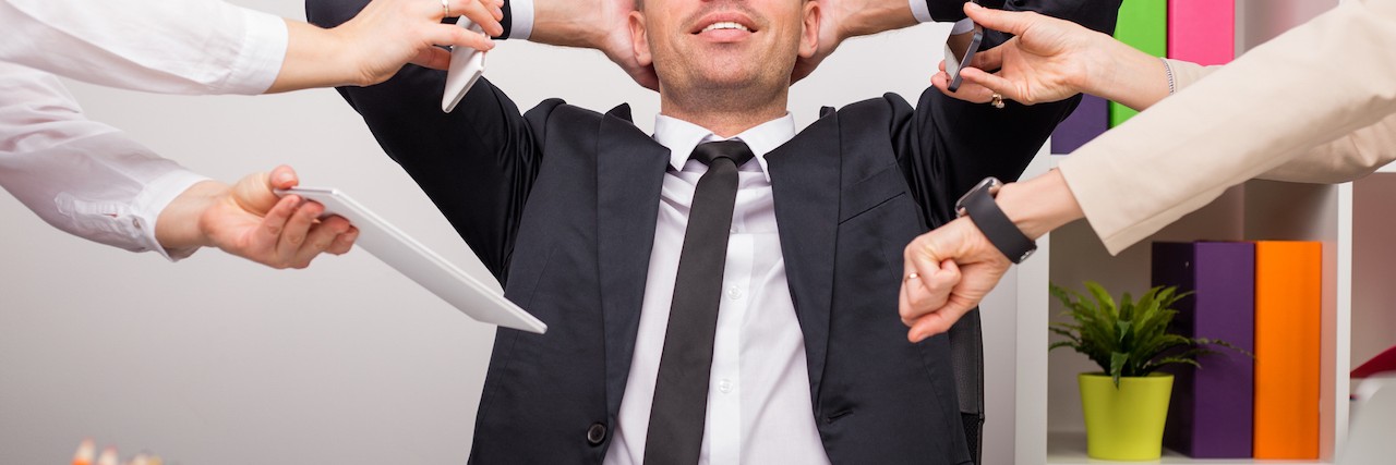 How to Survive (and Thrive) with Mental Illness at Work Man stays peaceful in a stressful office