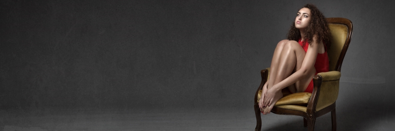 Lie Depressions Tells About Loved Ones girl sits alone in a dark room on a wooden chair