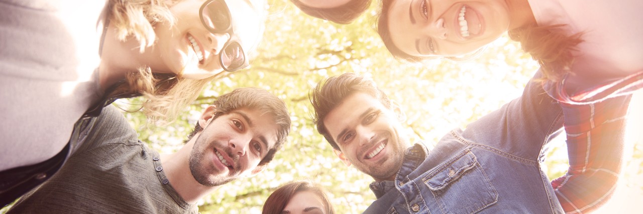 How to Help Others Help You on the Road to Eating Disorder Recovery A circle of people linking arms