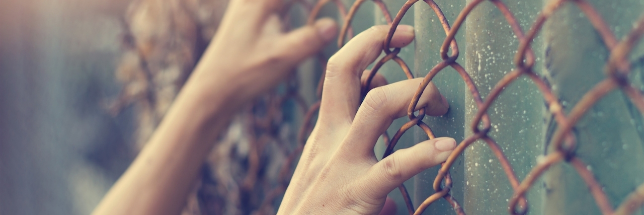 Anxiety and Depression: Dealing With the Voices in My Mind Hands clinging to a gate