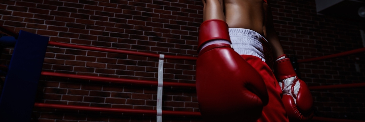 The Constant Battle Depression and Anxiety Female boxer looking over shoulder