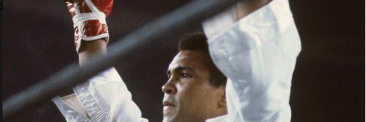 Honoring Muhammad Ali as a Mental Health Advocate Boxer facing the crowd with arms lifted