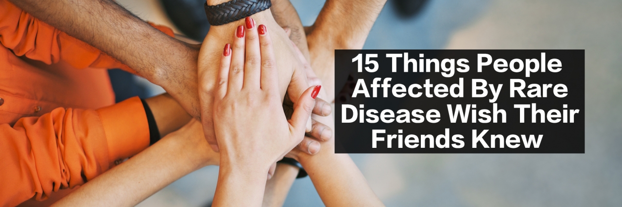 How to Help a Friend With a Rare Disease Multiethnic group of young people putting their hands on top of each other. Close up image of young students making a stack of hands.