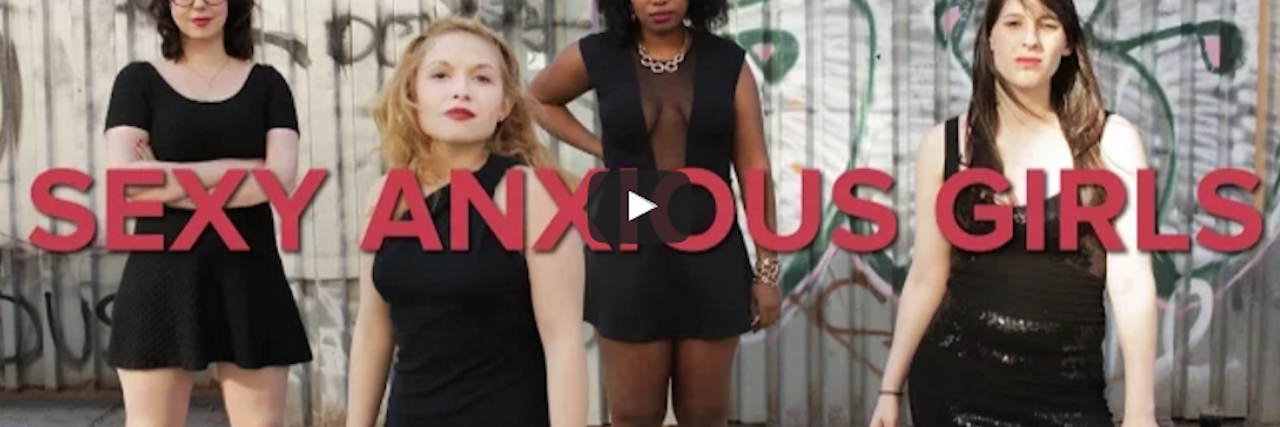 'Sexy Anxious Girl' Music Video by Comedy Duo Brit & Brit four girls in black dresses posing with the words Sexy Anxious Girls written across the screen