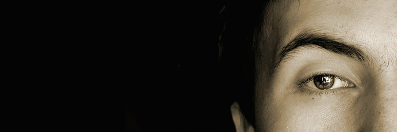 Conversation Between a Therapist and a Teenage Drug User young man looking forward