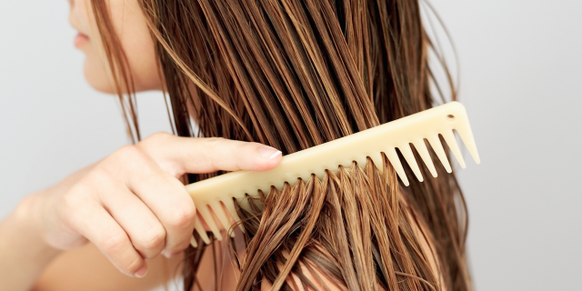 My Trichotillomania Is Not Just a 'Bad Habit' girl running a comb through her wet hair