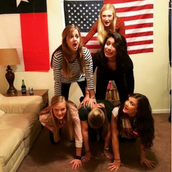 Six female friends making a pyramid