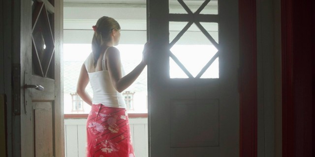 Our Home Isn’t a Hospital Woman standing in open door