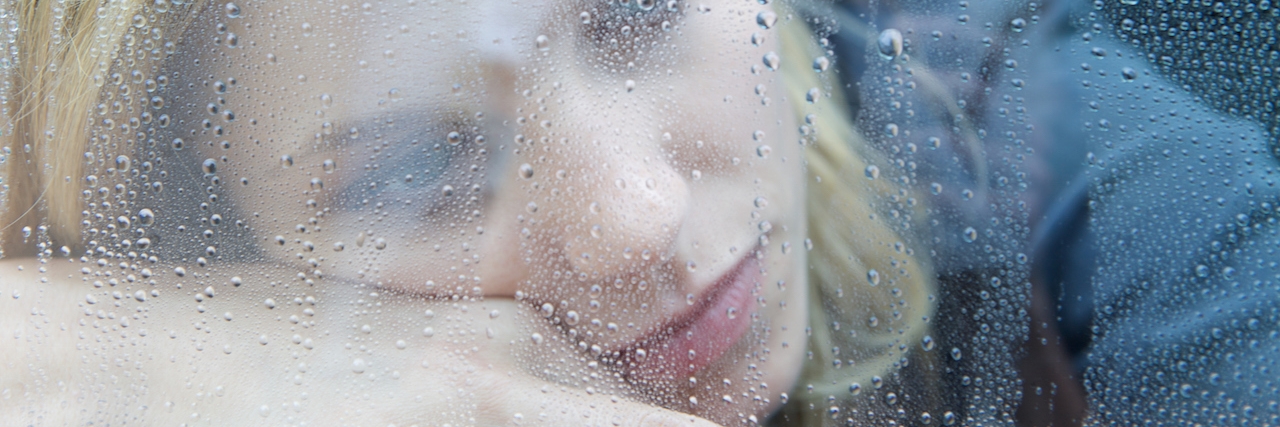 What Not to Say When Someone Says They Have Depression sad woman looking out a window