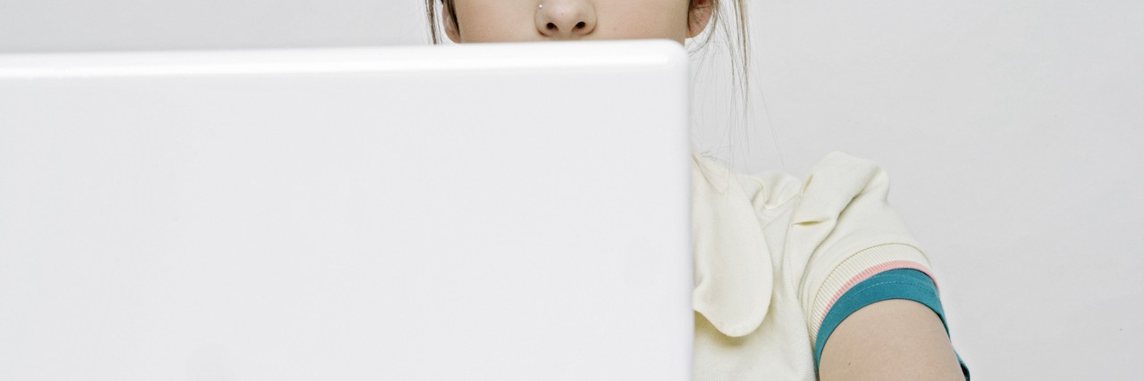 Eating Disorders: Why 'Thinspiration' Photos are Heartbreaking View of a teenage girl working with a laptop.
