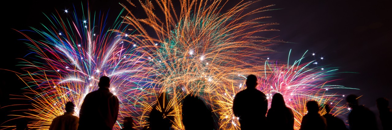 Grief, Sibling Loss and the Fourth of July: Handling Fireworks Big fireworks with silhouetted people in the foreground watching