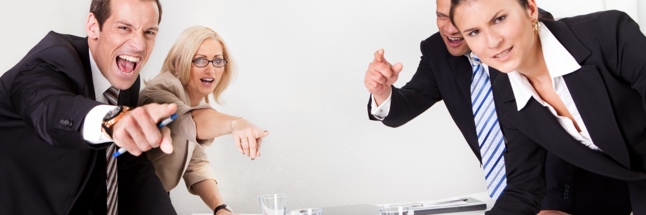 Having Chronic Pain and Experiencing Discrimination in the Work Place Four angry business people screaming at camera