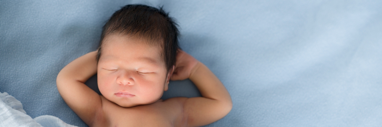 Postnatal Depression: Feeling Love for My Baby Took 6 Months Newborn baby sleeps on blue blankets