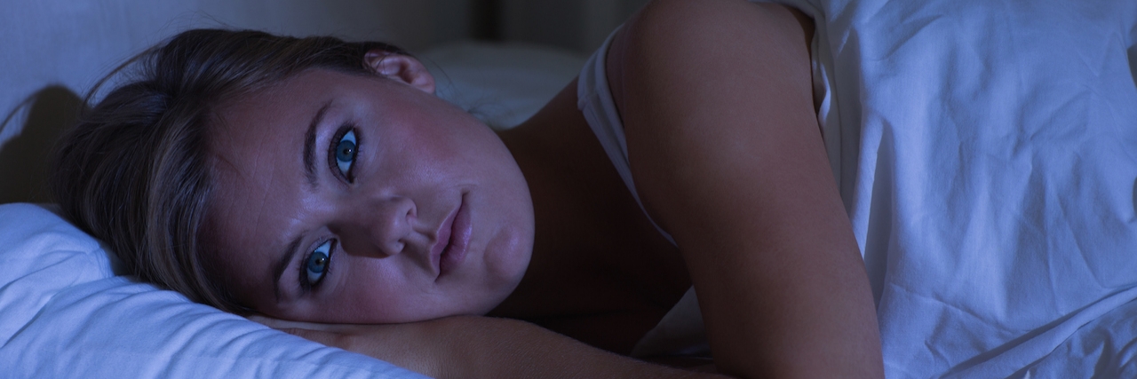 Inside the Mind of Someone With Insomnia at Night woman lying in bed who can't sleep