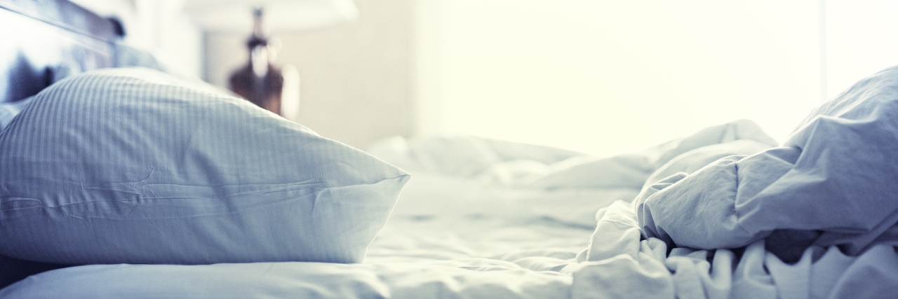 unmade bed in the morning