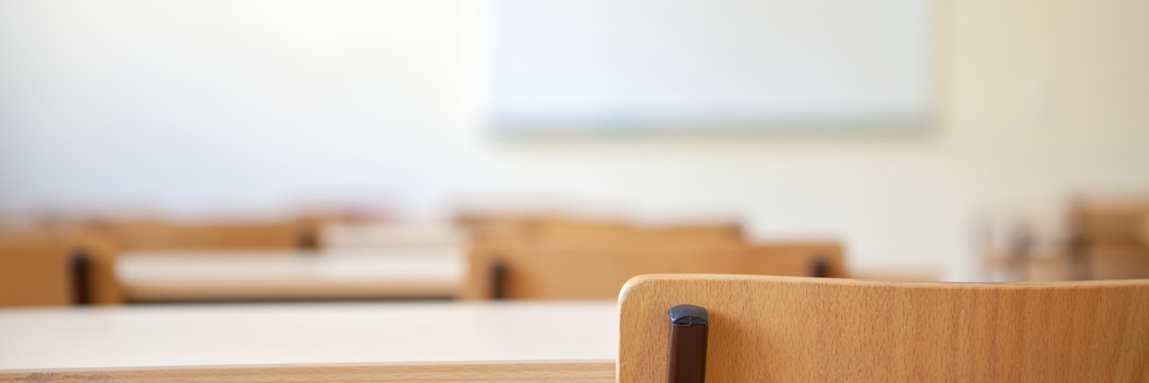 Joking About Belonging in a 'Mental Hospital' desks in a classroom