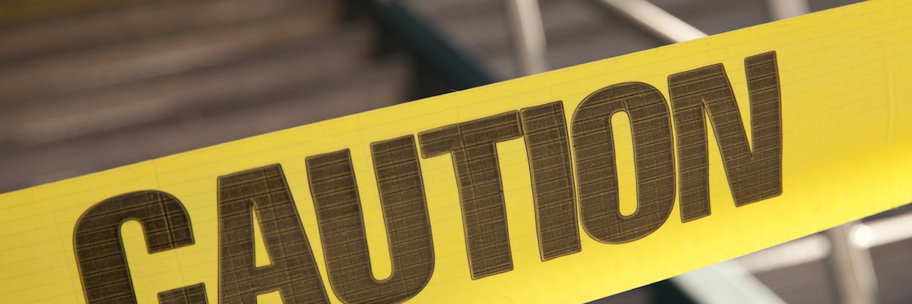 Why Mentioning Suicide Should Not Be Done Thoughtlessly caution tape in front of a stairwell