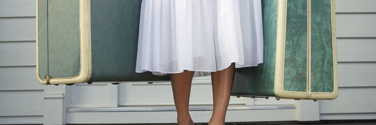 Self-Harm: The Abusive Relationship I Had With Myself Woman leaving entrance door carrying two suitcases