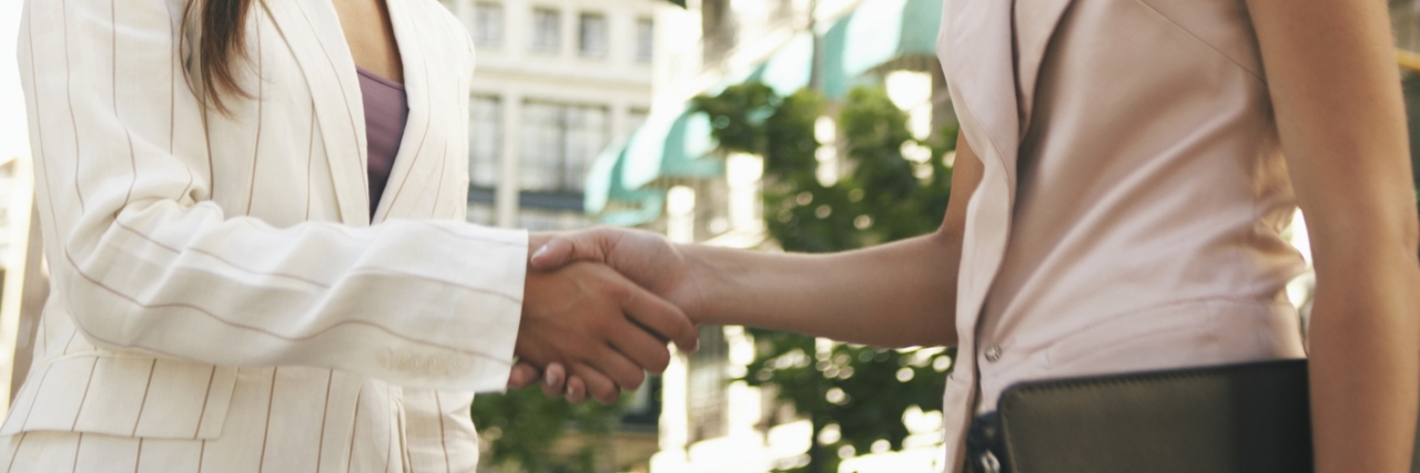 Answering 'How Are You?' as Someone With Depression Two women shaking hands in street, smiling