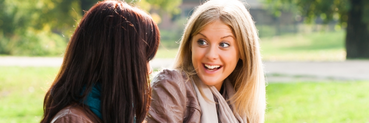 What People With Ehlers-Danlos Syndrome and POTS Would Like to Hear Two young woman sitting in the park and talking about something.