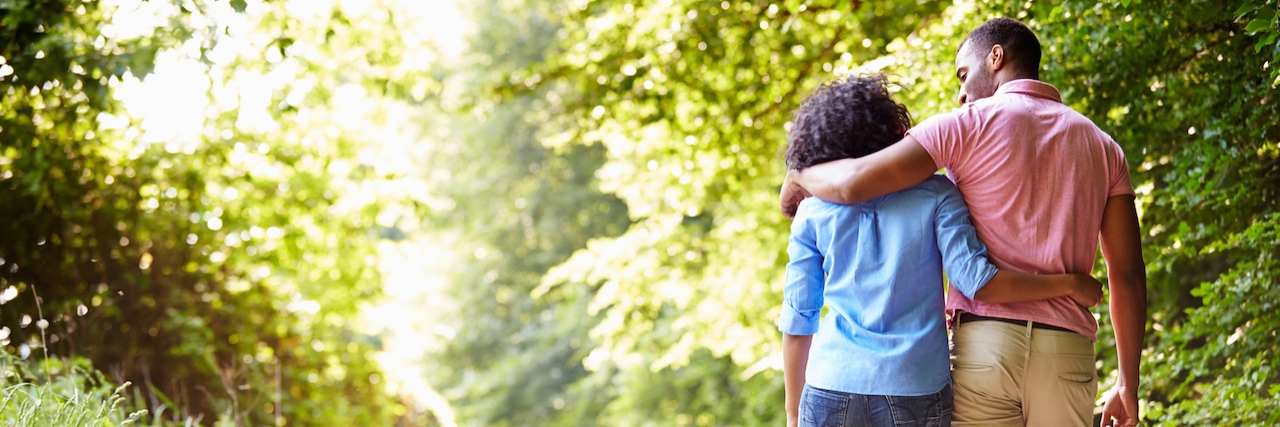 Dating Advice for People With Diseases couple walking on path in countryside