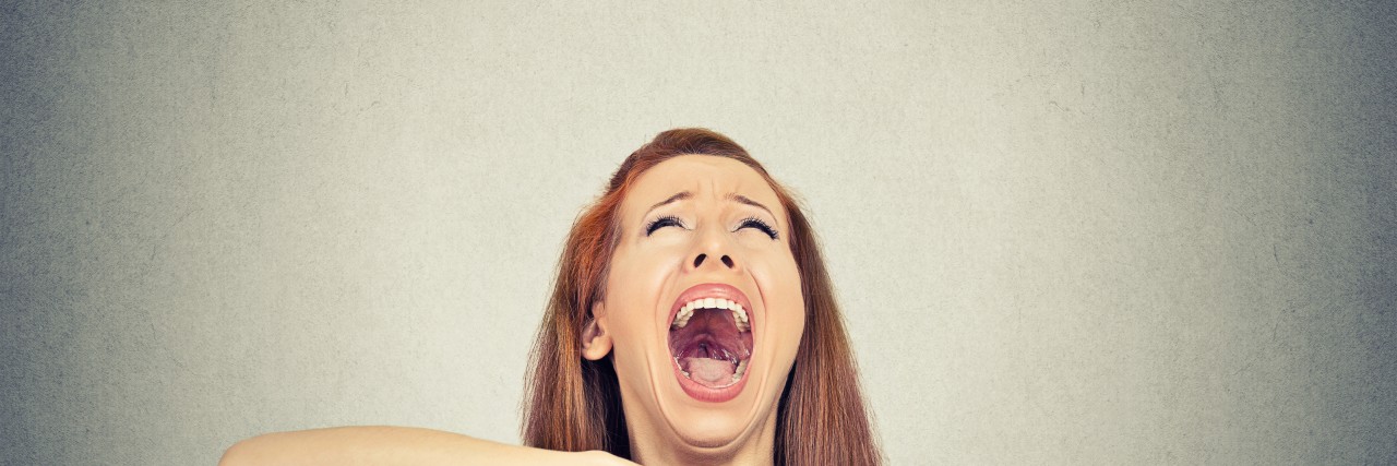 Facing Mortality as Someone With Pulmonary Hypertension Young woman showing time out hand gesture, frustrated screaming