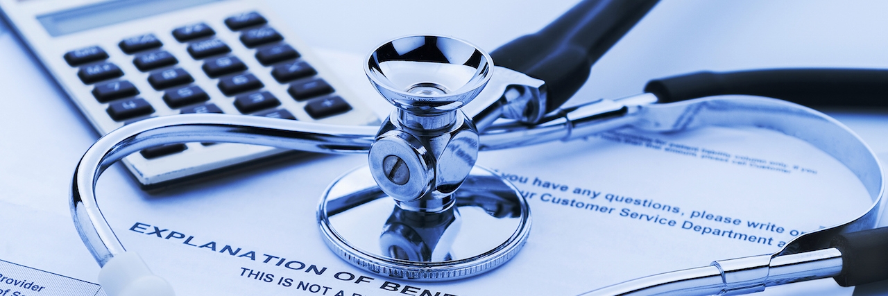 Turning 26 and Changing Health Insurance With Crohn's Disease stethescope, calculator and insurance form