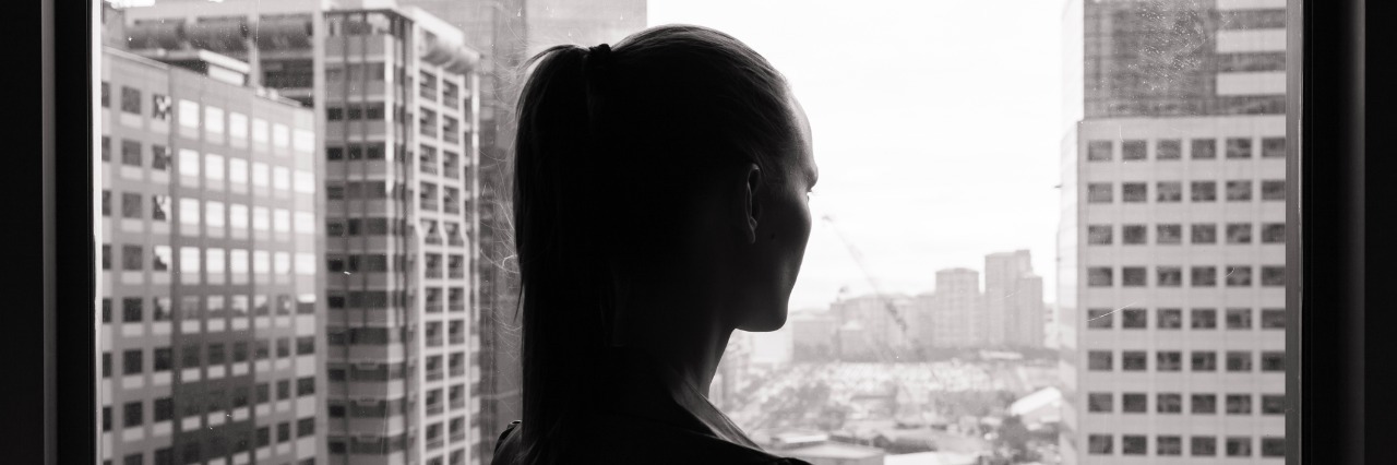 Treating Bipolar Disorder Doesn’t Mean You Won’t Have Bad Days Woman look out of office window thinking.