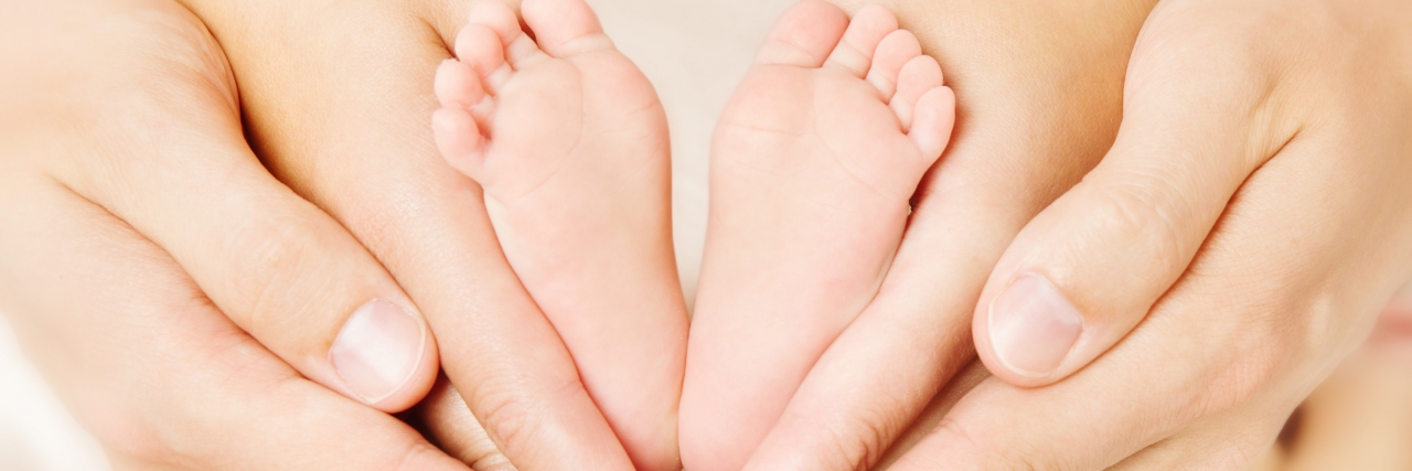 Learning It Will Be OK as the Parent of a Child With Down Syndrome Newborn baby feet.