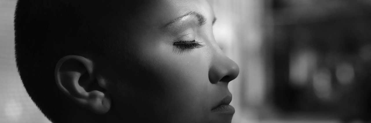 The Issues We Need to Discuss as Young Women With Breast Cancer Happy young cancer survivor enjoying sunlight