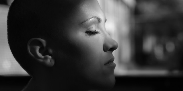 The Issues We Need to Discuss as Young Women With Breast Cancer Happy young cancer survivor enjoying sunlight