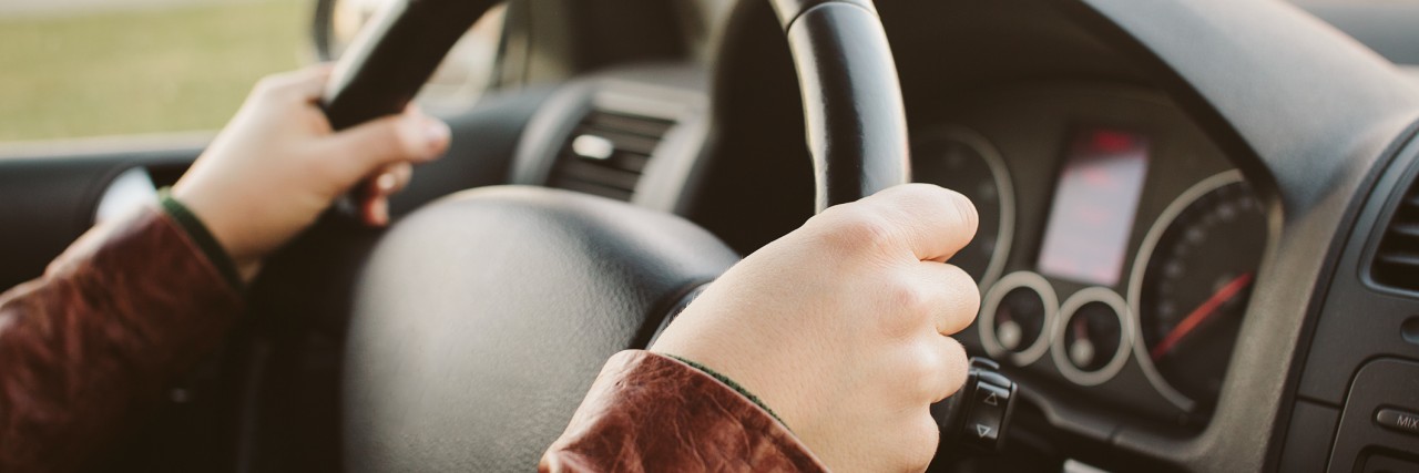 Learning to Drive as Someone on the Autism Spectrum woman's hands on the wheel of a car