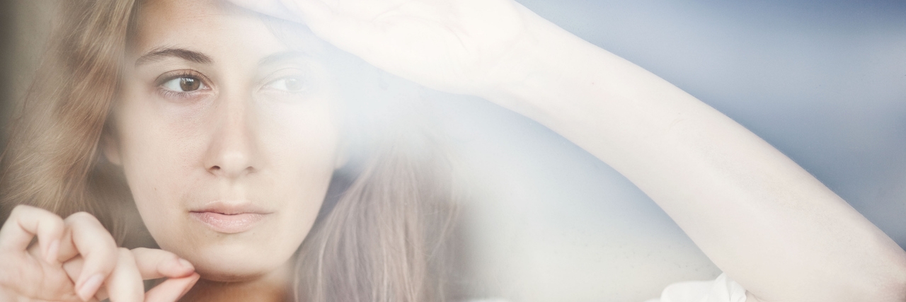 What It's Like Living With Depression and Anxiety Reflection of the girl in the window