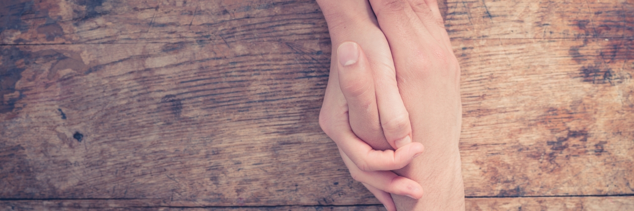 What to Know About My Life With Ehlers-Danlos syndrome and POTS Man and woman holding hands at a table