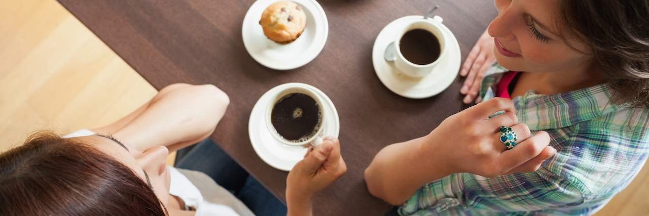 When My Colleague Had a Misconception of What Psychosis Looks Like Two students having a cup of coffee