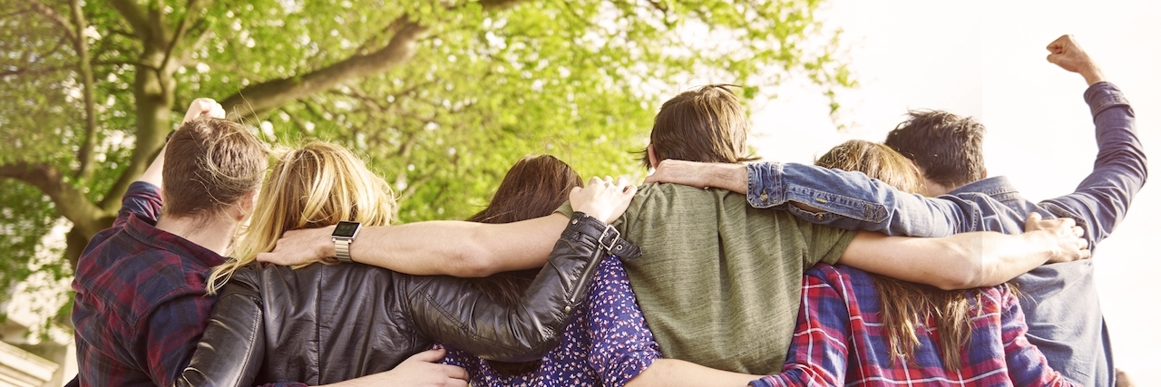 The Power of 'Spoonie' Friendship When Your Healthy Friends Don't Understand six friends with their arms around each other, back view