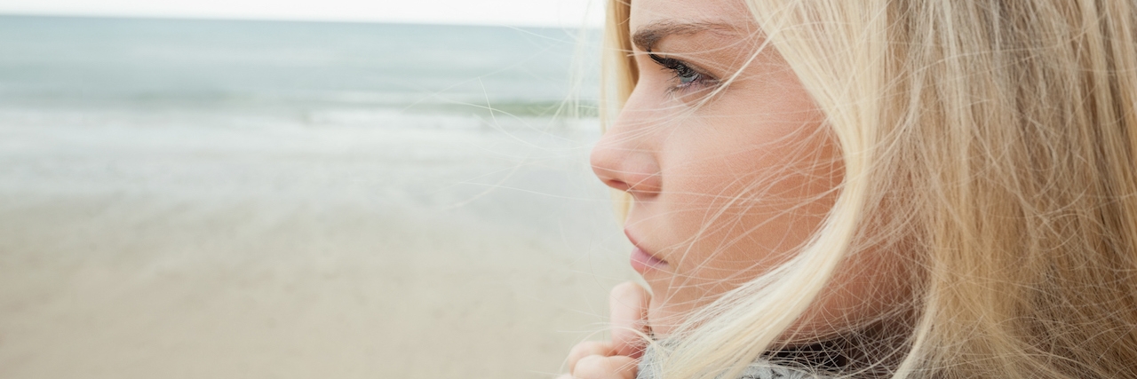 When I Tried To Tell My Family I Had Depression Cute young woman in gray knitted jacket on beach