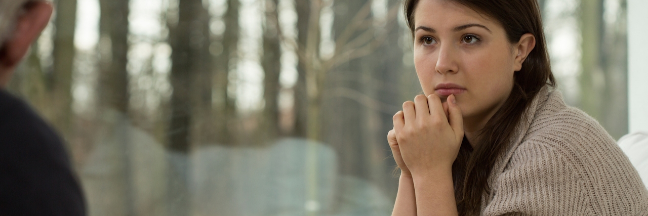 When a Therapist Is Not the Right Fit for Your Needs Woman sitting with a therapist in an office