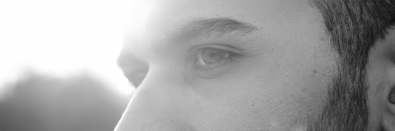 What to Know About People With Dissociative Identity Disorder close up of young men, strong sun light