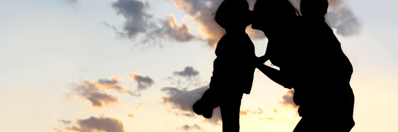 A Letter to Sanfilippo Syndrome From a Mother Mother with Two Young Children Hugging and Kissing