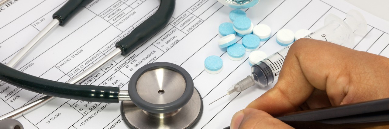 Letter to Doctors and Politicians Who Can Advocate for Pain Medication Doctor hand writing a medical prescription with pill bottle and stethescope