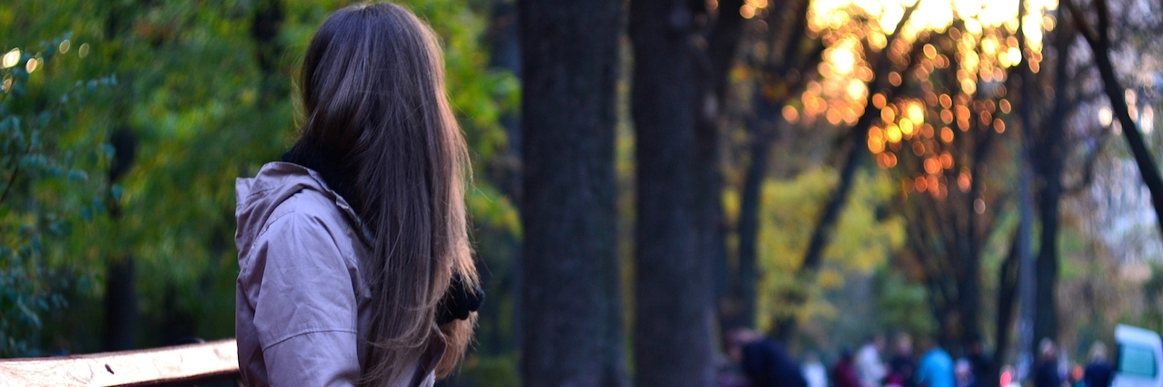 Adapting to Life With Multiple Sclerosis Girl sitting on the bench in park in the evening