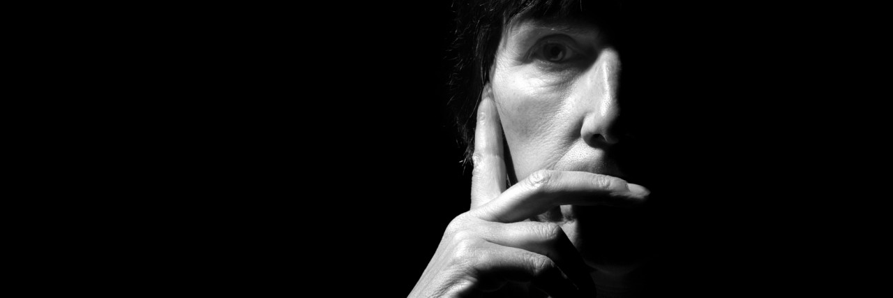 What Chronic Fatigue Syndrome Really Feels Like for Me Pensive. Dark Rembrandt style lighting. Monochrome black and white.