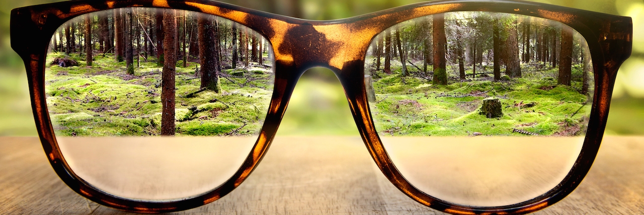 What I Do to Feel Good on the ‘Bad Days’ With Bipolar Disorder Glasses on a wooden table